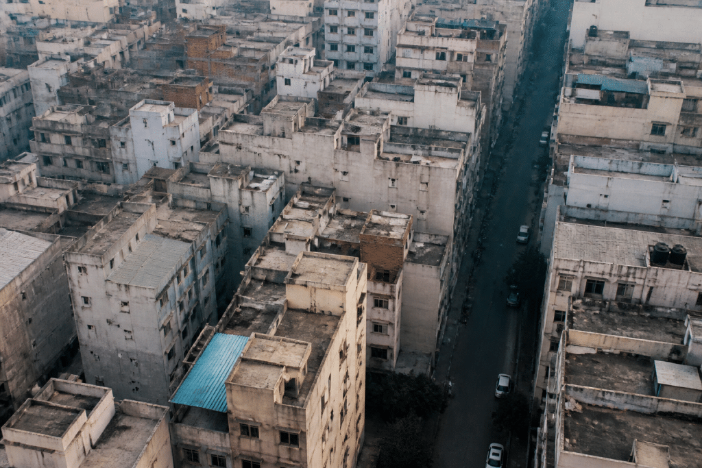 Aerial view of dense urban buildings and streets below